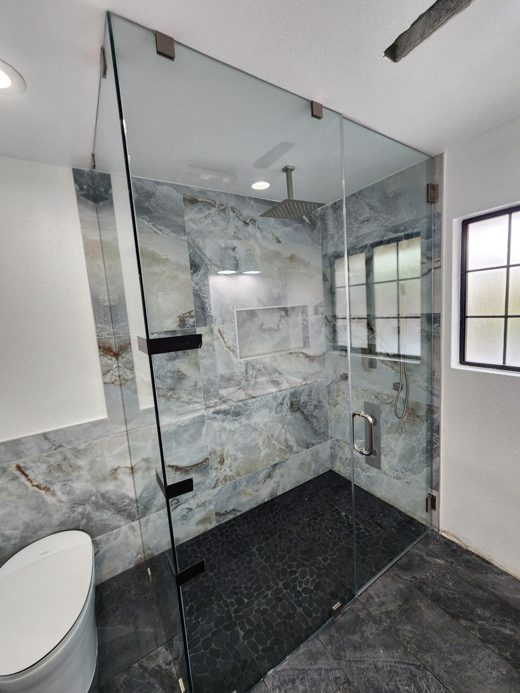 Frameless glass marble shower