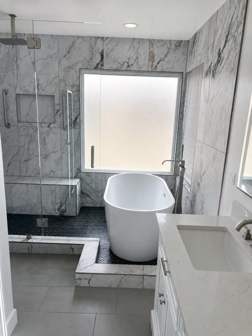Freestanding tub and marble walls